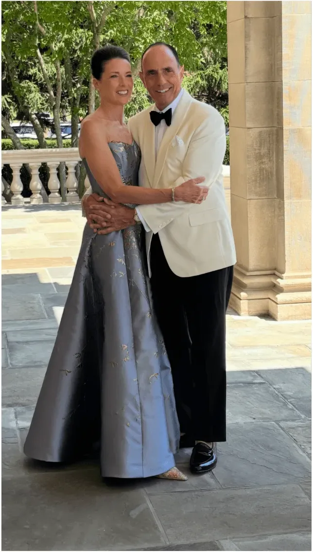 Client in a periwinkle ball gown at a black tie event